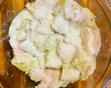 A picture of step 1 of Hake in the oven under a cheese crust.