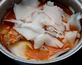 A picture of step 5 of Southern Thai Sour Curry with Salmon Head and Pickled Bamboo Shoots.