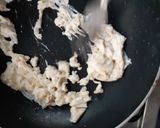 A picture of step 3 of Beans on scrambled egg on toast.