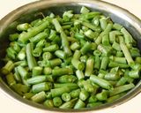 A picture of step 1 of Beans Broccoli poricha koottu with mung.