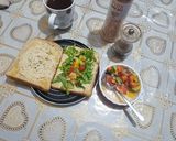 A picture of step 6 of Humus sandwich with rocket and crunchy bright salad.