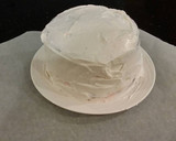 A picture of step 26 of Chocolate Layer Cake with Strawberry Cream Filling, White Chocolate Ganache Frosting coated with a Chocolate Crumble.