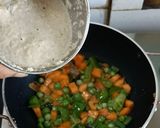 A picture of step 5 of Vegetable Paneer korma in white gravy.