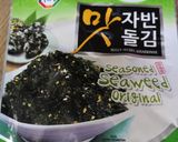 A picture of step 7 of Fusion risotto. Prawn, chorizo and broccoli topped with seaweed.