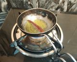 A picture of step 14 of Mooli Gajar Shalgam Kadhi.