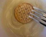 A picture of step 2 of Chocolate covered Ritz crackers filled with white chocolate or peanut butter.