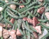 A picture of step 3 of Green Beans and Sausage in a Sauce.