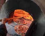 Foto del paso 6 de la receta: Pizza al horno de leña