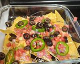 A picture of step 1 of 4 Cheese loaded nachos.