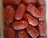A picture of step 1 of Mini sausage skewers with pancetta and peas.