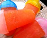 A picture of step 6 of Orange with Rooh afzah Popsicle.