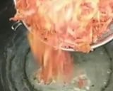 A picture of step 2 of Gajar ka halwa with milkmaid.