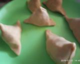 A picture of step 2 of Samosa with tomato sauce/coriander chutney and tea.