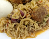 A picture of step 2 of Indomie with ketchup.