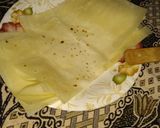 A picture of step 7 of Bihari Parcels with cheesy blast.