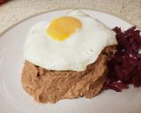 A picture of step 9 of Corned Beef Hash with a fried egg on top.