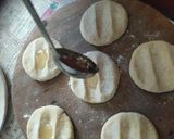 A picture of step 3 of 2 layered Roti (Bepadi Roti).