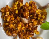 A picture of step 2 of Crispy Corn 🌽 with fried Garlic 🧄.