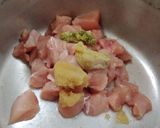 A picture of step 1 of Chicken 65 with gravy.