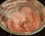 A picture of step 12 of Dark Chocolate Layer Cake with Fresh Strawberry Cream Frosting and Filling.