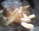 A picture of step 3 of Mayo garlic French Fries.