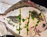 A picture of step 2 of Roasted Turbot Stuffed with Fresh Herbs and Lemon.