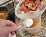 Foto del paso 10 de la receta Guiso de merluza con gambas y almejas
