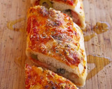 Foto del paso 12 de la receta: Rulo de pizza de jamón, quesos y olivas