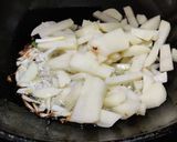 A picture of step 2 of Runner beans and potato fry with onion and onion greens.