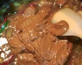 A picture of step 3 of Ulli theeyyal (shallots cooked in roasted coconut gravy and tamarind juice).