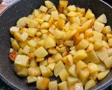 Une image de l'étape 7 de Pommes de terre sautées aux oignons nouveaux.