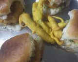 A picture of step 7 of Vadapav with green spicy chutney.