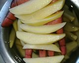 A picture of step 1 of Baked potato wedges.