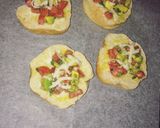 A picture of step 4 of Cheesy bread with tomatoes & avocado salsa.