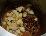 A picture of step 7 of Desi Spiced Chickpeas and Potatoes.