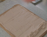 A picture of step 11 of Cocoa Swiss Roll with Chocolate Cream.