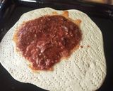 A picture of step 5 of Smokie pizza.
