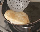 A picture of step 11 of Luchi and Cholar Dal.