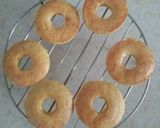 A picture of step 7 of Baked Mango Doughnuts with Mango Glaze.