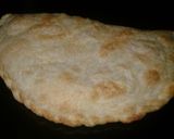 Foto del paso 4 de la receta: Empanada gigante de tomate, queso y huevos