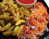 A picture of step 6 of Baked Herbed Potatoes with kachumbari and sauce.