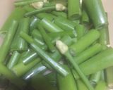 Foto langkah ke 1 dari resep Tumis Bunga Bawang Tempe Teri.