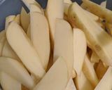 A picture of step 1 of Spicy potato wedges.