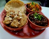 A picture of step 4 of Ashtami Bhog Thali (Halwa, Puri, Kala Chana).