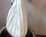 A picture of step 1 of Shahi Gulab Coconut Shrikhand.