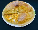 A picture of step 7 of Stuffed green moong dal cheela with paneer burji & cheese.