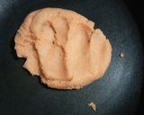 A picture of step 2 of Mawa Stuffed sesame laddu.