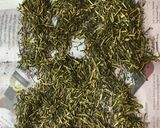 A picture of step 3 of Japanese green tea leaf - refreshed and revived again.