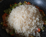 Foto del paso 3 de la receta: Arroz rojo con Maíz