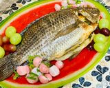 A picture of step 5 of Tilapia baked with carrots and onions.